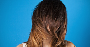 Woman with hair over her face
